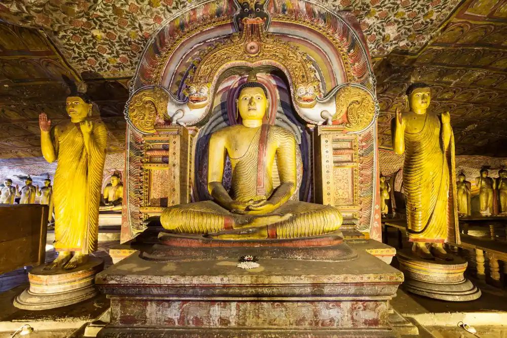 Buddha statues inside the painted Dambulla Cave Temple in Sri Lanka