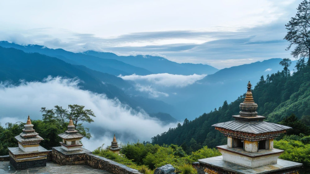 Chortens at Dochula Pass above a cloud-filled valley on the Thimphu to Punakha road in Bhutan