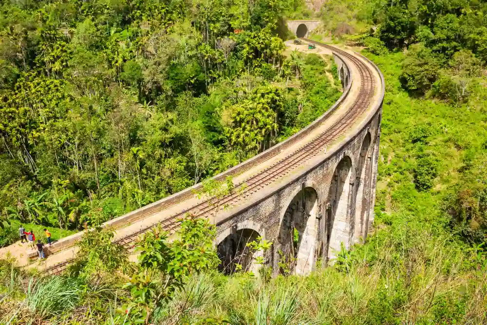 Nine Arch Bridge curving through green jungle near Ella, on the Trip to Sri Lanka: Teardrop of the Indian Ocean tour