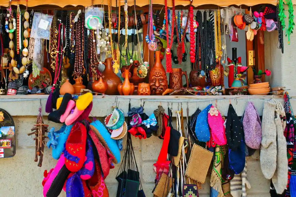 Souvenir stall with colourful woollen hats, masks and handicrafts in a Kathmandu market, Nepal