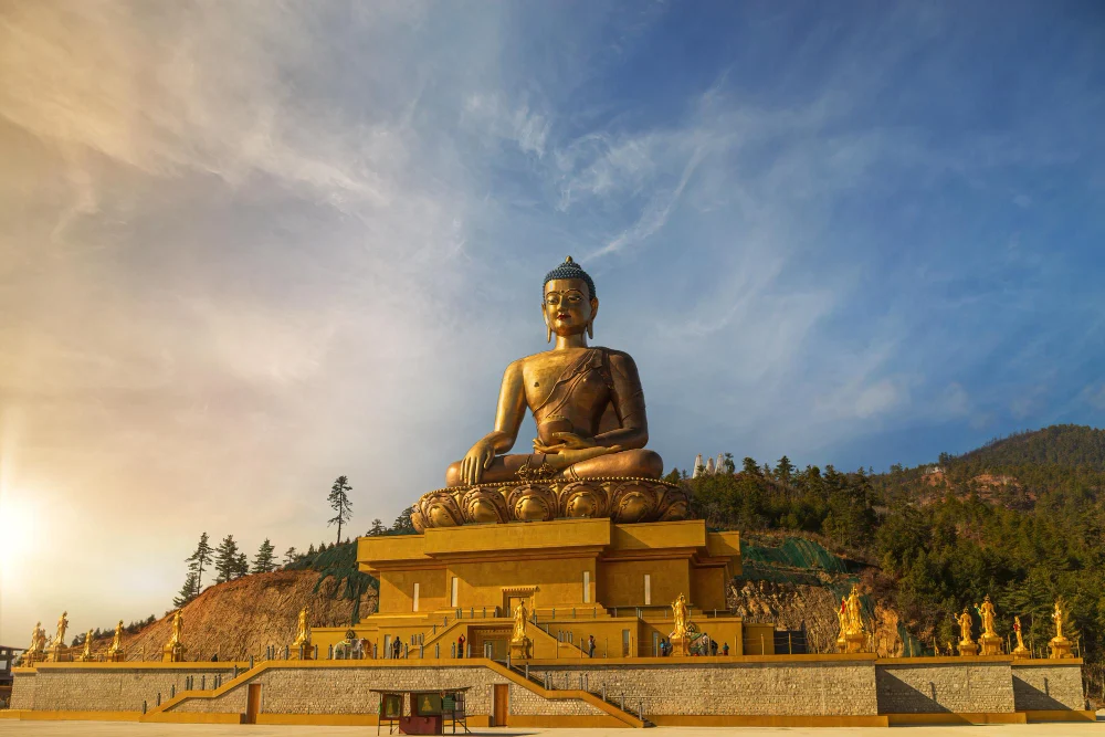 Golden Buddha Dordenma statue overlooking Thimphu at sunset, on The Dragon's Whisper journey through Bhutan's sacred dzongs